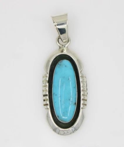 NAVAJO BY BEN YAZZIE STERLING SILVER TURQUOISE PENDANT: NAVAJO BY BEN YAZZIE STERLING SILVER TURQUOISE PENDANT Description Navajo BY Ben Yazzie Sterling Silver Turquoise Pendant Pendant is in good condition. May show signs of wear and/or tear. Approximate 