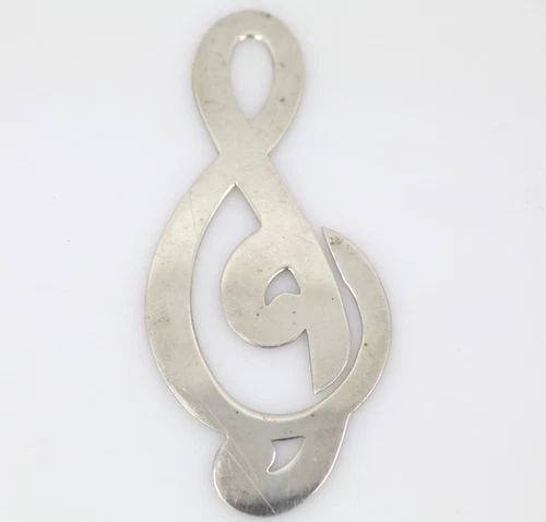 TIFFANY & CO. STERLING SILVER TREBLE CLEF MUSICAL NOTE BOOKMARK: Description TIFFANY & CO. Sterling Silver Treble Clef Musical Note Bookmark Item is in good condition. May show signs of wear and/or tear. Approximate Measurements Bookmark Length: 3" Bookmark Width: 