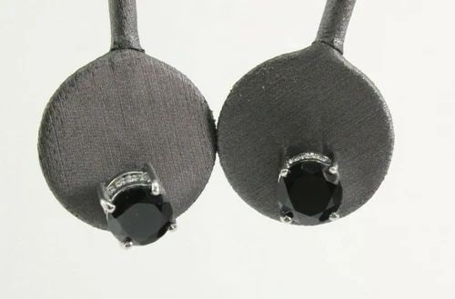 6 TCW BLACK ONYX STONES IN STERLING SILVER ACCENT EARRINGS: 6 TCW BLACK ONYX STONES IN STERLING SILVER ACCENT EARRINGS Description Black Onyx Studs in Sterling Silver w/Cubic Zirconia Earrings Item is in great condition. May show signs of wear and/or tarnish. 