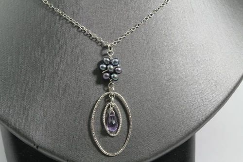 STERLING SILVER NECKLACE W/PURPLE DANGLING STONE & BLISTER PEARL FLOWER DESIGN: STERLING SILVER NECKLACE W/PURPLE DANGLING STONE & BLISTER PEARL FLOWER DESIGN Description Sterling Silver Necklace with Oval Shaped Pendant w/dangling Purple Tear Drop Shaped Stone and Blister Pearls