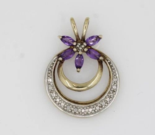 DESIGNER STERLING SILVER AMETHYST MARQUISE FLOWER CIRCLE PENDANT 1.9G: DESIGNER STERLING SILVER AMETHYST MARQUISE FLOWER CIRCLE PENDANT 1.9G Description Designer Sterling Silver Amethyst Marquise Flower Circle Pendant Pendant is in good condition. May show signs of wear.