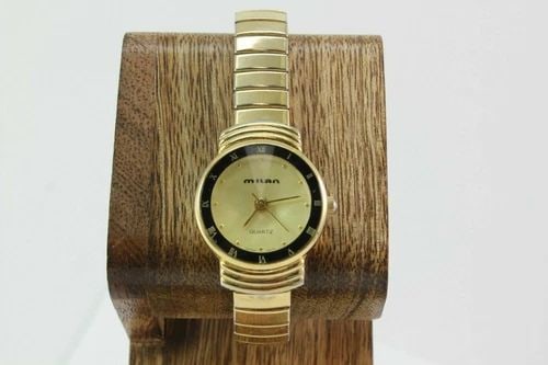 MILAN MLN1002 ROMAN NUMERAL BEZEL GOLD TONE STRETCH STAINLESS STEEL WATCH (1 of 2)