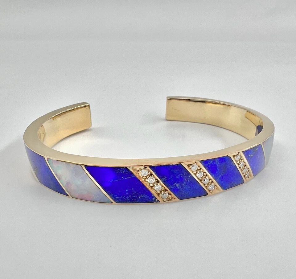 NAVAJO 18K YELLOW GOLD NATURAL LAPIS LAZULI & FIRE OPAL & DIAMOND CUFF BRACELET: NAVAJO 18K YELLOW GOLD NATURAL LAPIS LAZULI & FIRE OPAL & DIAMOND CUFF BRACELET Vintage Navajo 18K Yellow Gold Natural Lapis Lazuli & Fire Opal & Diamond Cuff Bracelet Cuff is 5 1/4" Tip to Tip and ha