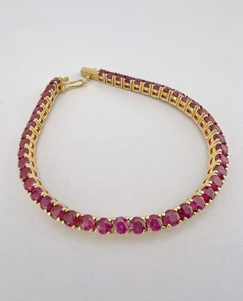 DESIGNER 12K YELLOW GOLD 6.75CT ROUND CUT RUBY INFINITY TENNIS BRACELET 6.25": DESIGNER 12K YELLOW GOLD 6.75CT ROUND CUT RUBY INFINITY TENNIS BRACELET 6.25" Designer 12k Yellow Gold 6.75ct Round Cut Ruby Infinity Tennis Bracelet 6.25" Size: 6.25" Long By (3mm) Wide Metal: Hallma