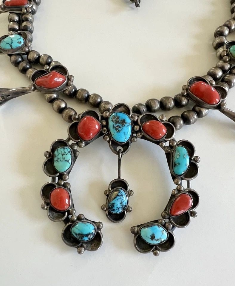 31" VTG NAVAJO STERLING SILVER TURQUOISES & CORAL SQUASH BLOSSOM NECKLACE 188.5G: 31" VTG Navajo Sterling Silver Turquoises & Coral Squash Blossom Necklace 188.5g This Amazing necklace features huge specimens Natural Red Coral & Webbed Kingman Turquise, secure in a Smooth bezel. Ne