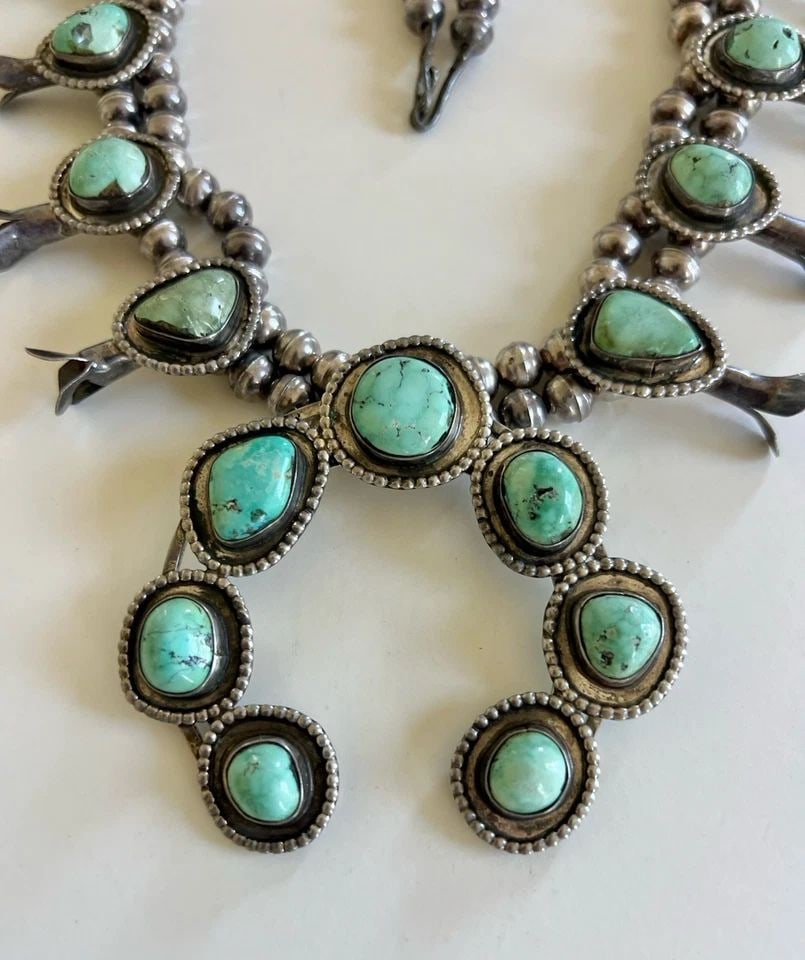 VTG NAVAJO STERLING SILVER DRY CREEK TURQUOISE SQUASH BLOSSOM NECKLACE 27" -186G: Vtg Navajo Sterling Silver Dry Creek Turquoise Squash Blossom Necklace 27" -186.5g This Amazing necklace features huge specimens of Dry Creek Turquoise, secure in a Smooth bezel. Necklace has 8.5mm Wi