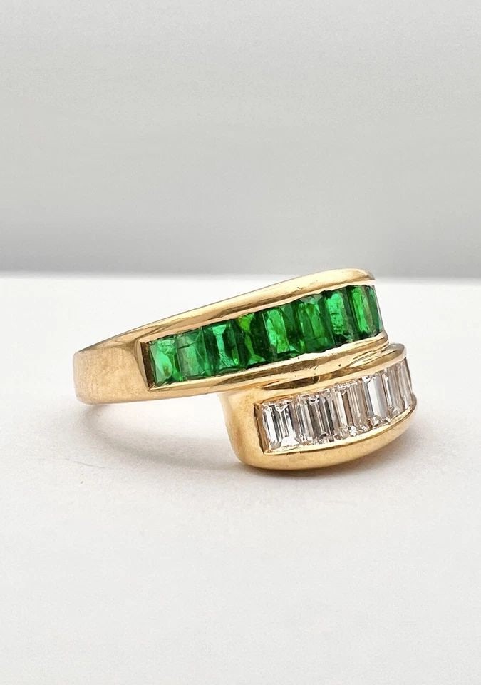 18K YELLOW GOLD EMERALD & DIAMOND BAGUETTE CHANNEL SET WRAP BYPASS BAND RING: 18K YELLOW GOLD EMERALD & DIAMOND BAGUETTE CHANNEL SET WRAP BYPASS BAND RING 18K Yellow Gold Emerald & Diamond Baguette Channel Set Wrap Bypass Band Ring Ring Size is 5.5 - Can Be Re Sized Total Weigh
