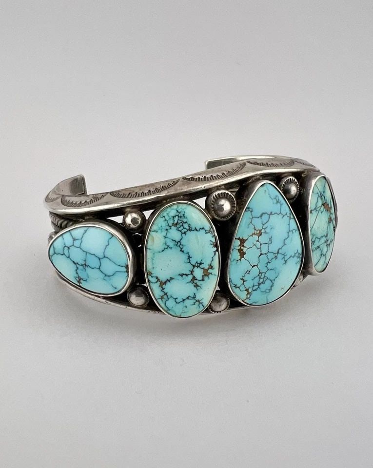 OLD 1940S NAVAJO STERLING SILVER #8 TURQUOISE STAMPED CUFF BRACELET 81G: OLD 1940S NAVAJO STERLING SILVER #8 TURQUOISE STAMPED CUFF BRACELET 81G Old 1940s Navajo Sterling Silver #8 Turquoise Stamped Cuff Bracelet 81g Cuff is 5 1/8" tip to Tip and has a 1 1/2" Wide - Can Be