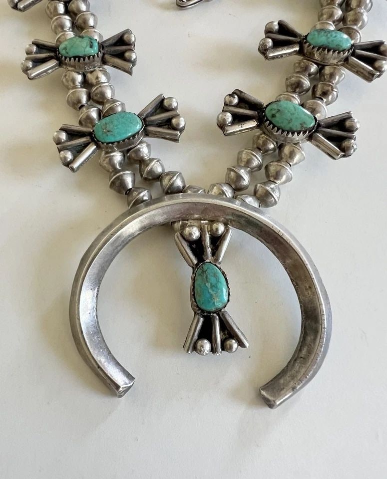 OLD PAWN NAVAJO STERLING SILVER TURQUOISE SQUASH BLOSSOM BOW NECKLACE 25.5": Early Old Pawn Navajo Sterling Silver Nevada Turquoise Squash Blossom Bow Necklace 25.5"This Amazing necklace features huge specimens of Natural Old Nevada Turquoise, secure in a Sawtooth bezel. Neckl