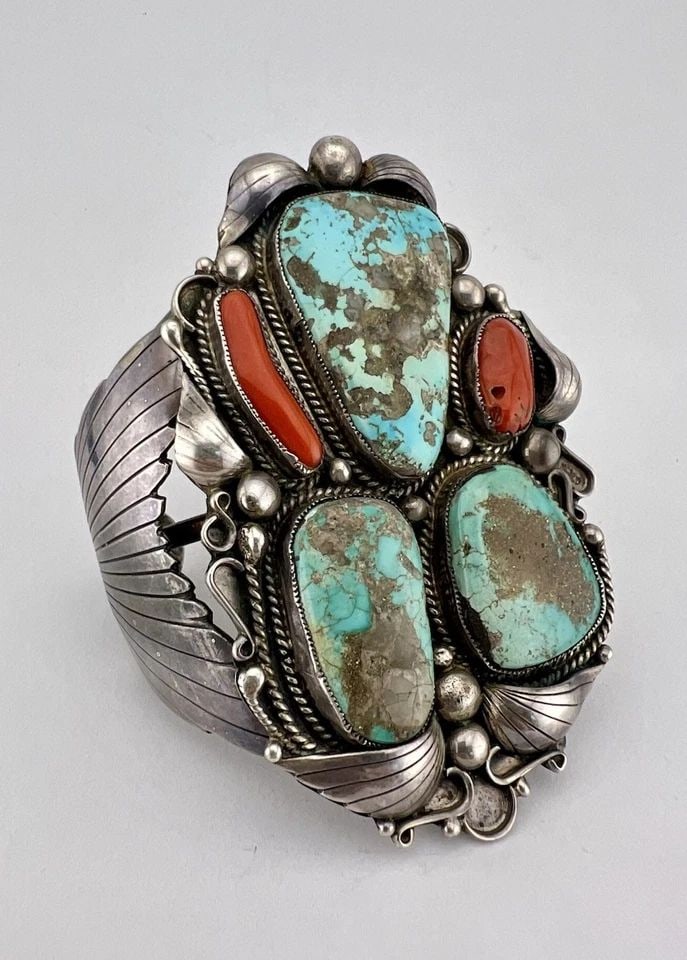 HUGE NAVAJO STERLING SILVER FOX TURQUOISE & CORAL STAMPED CUFF BRACELET 121.5G: MASSIVE Navajo Sterling Silver Fox Turquoise & Coral Stamped Cuff Bracelet 121.5g Cuff is 5 1/4" tip to Tip and has a 1 1/4" Wide Slightly Adjustable Gap Cuff Is Just Over 3 1/2" Wide In the Center We