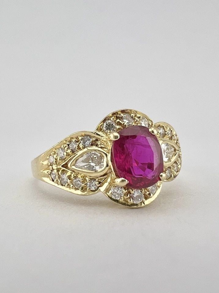 FINE .85CT OVAL BURMA THAI RUBY & HIGH QUALITY ROUND & PEAR SHAPED DIAMOND RING: FINE .85CT OVAL BURMA THAI RUBY & HIGH QUALITY ROUND & PEAR SHAPED DIAMOND RING Fine .85ct Oval Burma Thai Ruby & High Quality Round & Pear Shaped Diamond Ring Ring Size: 8 - Can Be Resized Metal: 18k