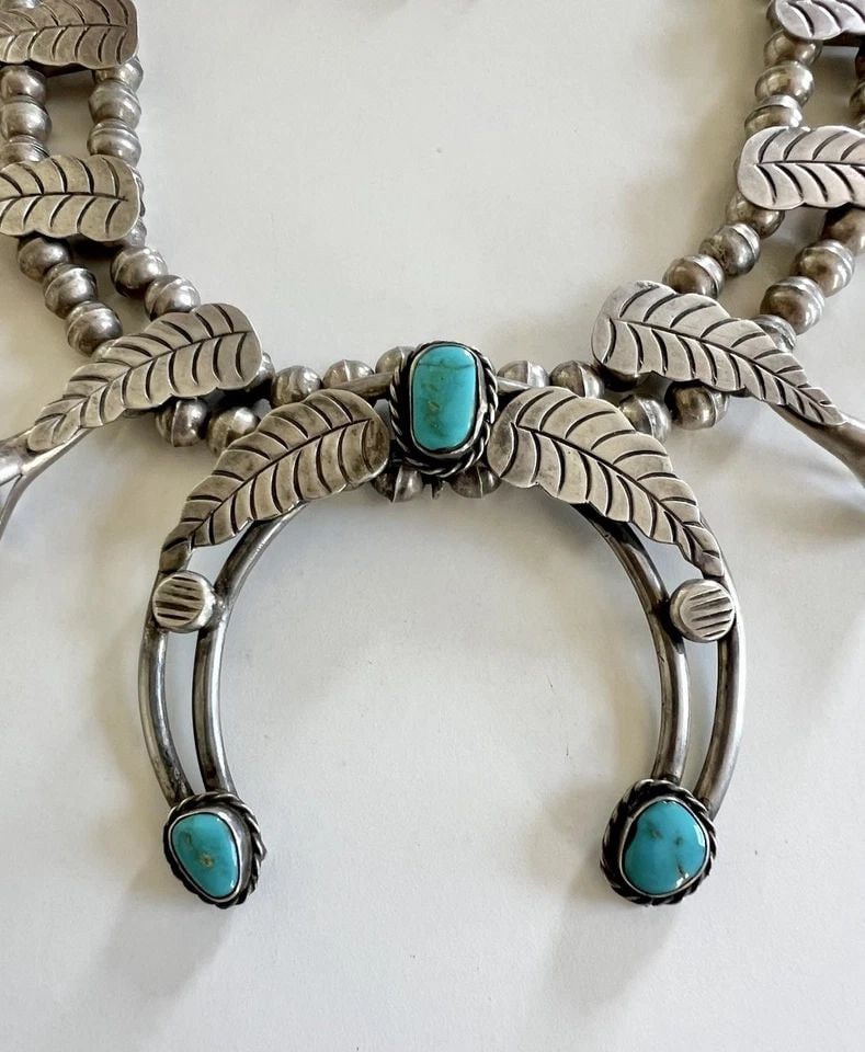 VTG NAVAJO STERLING SILVER TURQUOISE STAMPED FEATHER SQUASH BLOSSOM NECKLACE 27": Vtg Navajo Sterling Silver Turquoise Stamped Feather Squash Blossom Necklace 27" This Amazing necklace features huge specimens of Natural High-Grade Blue Gem Turquoise, secure in a Smooth bezel, and f