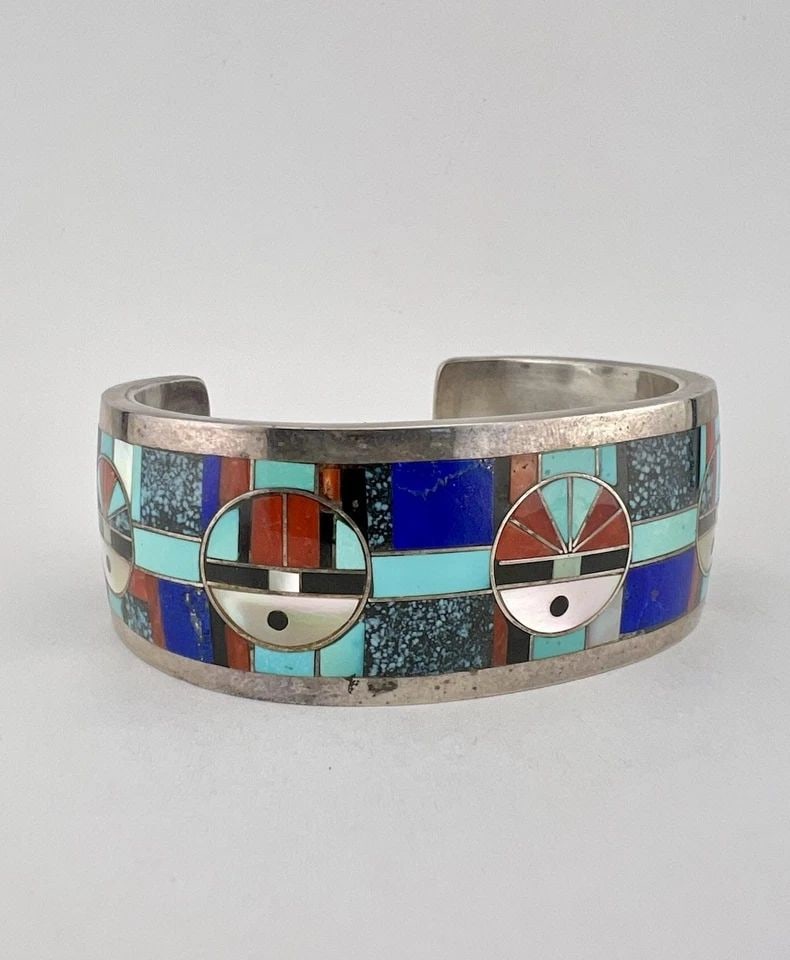 GILBER & MILDRED CALAVAZA ZUNI STERLING SILVER GEMS SUNFACE CUFF BRACELET 89G: GILBER & MILDRED CALAVAZA ZUNI STERLING SILVER GEMS SUNFACE CUFF BRACELET 89G RARE Gilber & Mildred Calavaza ZUNI Sterling Silver Gems Sunface Cuff Bracelet 89g Cuff is 5 1/2" tip to Tip and has a Sli