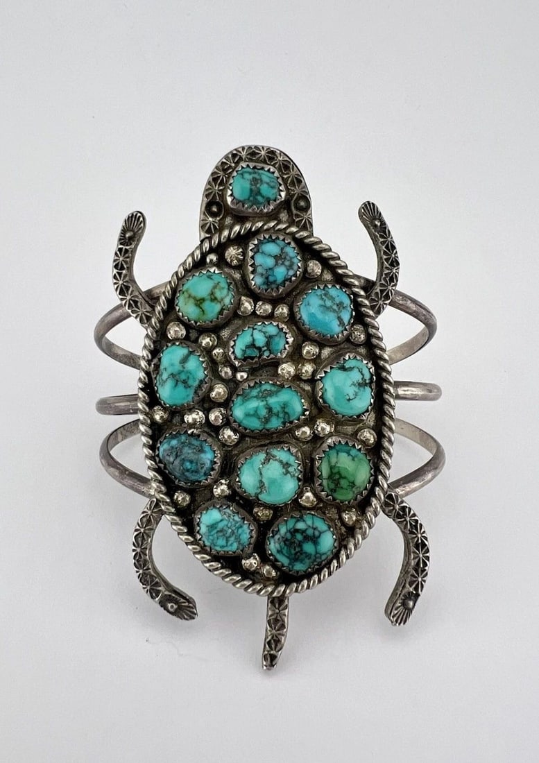 HUGE NAVAJO STERLING SILVER HIGH GRADE TURQUOISE STAMPED TURTLE CUFF BRACELET: HUGE Navajo Sterling Silver High Grade Turquoise Stamped Turtle WIDE Cuff Bracelet Cuff is 5 3/8" tip to Tip and has a 1 1/8" Wide Adjustable Gap Cuff Is Over 3 1/4" Wide In the Center Weight is 67.3 