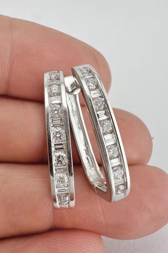 DESIGNER 14K WHITE GOLD 1.00CT ROUND & BAGUETTE DIAMOND LONG HOOP POST EARRINGS: DESIGNER 14K WHITE GOLD 1.00CT ROUND & BAGUETTE DIAMOND LONG HOOP POST EARRINGS Designer 14K White Gold 1.00ct Round & Baguette Diamond Long Hoop Post Earrings Size: About 1" Tall by 5/8" Deep By 3.5m