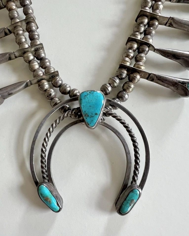 VINTAGE NAVAJO STERLING SILVER BLUE GEM TURQUOISE SQUASH BLOSSOM NECKLACE 25.5": Vintage Navajo Sterling Silver Blue Gem Turquoise Squash Blossom Necklace 25.5" This Amazing necklace features huge specimens of Natural Blue Gem Turquoise, secure in a Smooth bezel in A Blossom Desig