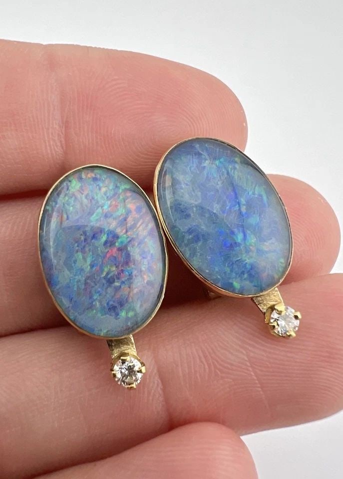VINTAGE 14K YELLOW GOLD OVAL FIRE OPAL DOUBLETS & DIAMOND OMEGA BACK EARRINGS: VINTAGE 14K YELLOW GOLD OVAL FIRE OPAL DOUBLETS & DIAMOND OMEGA BACK EARRINGS Vintage 14k Yellow Gold Oval Fire Opal Doublets & Diamond Omega Back Earrings Size: 7/8" Tall by 3/8" Wide Weight is 7.5 G