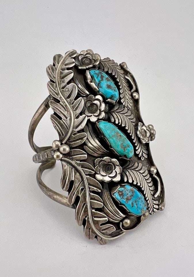 HUGE NAVAJO STERLING SILVER KINGMAN TURQUOISE STAMPED 3.25" WIDE CUFF BRACELET: HUGE Navajo Sterling Silver Kingman Turquoise Stamped 3.25" Wide Cuff Bracelet Cuff is A Tad Over 5 1/4" tip to Tip and has a Just Under 1 1/4" Wide - Adjustable Gap Cuff Is 3 1/4" Wide In the Center 