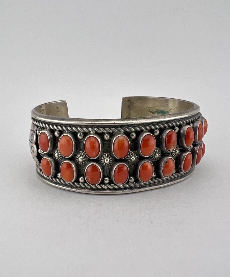DELBERT GORDON NAVAJO STERLING SILVER MEDITERRANEAN CORAL STAMPED CUFF BRACELET: DELBERT GORDON NAVAJO STERLING SILVER MEDITERRANEAN CORAL STAMPED CUFF BRACELET Vtg Delbert Gordon Navajo Sterling Silver Mediterranean Coral Stamped Cuff Bracelet Cuff is 5 3/4" tip to Tip and has a 