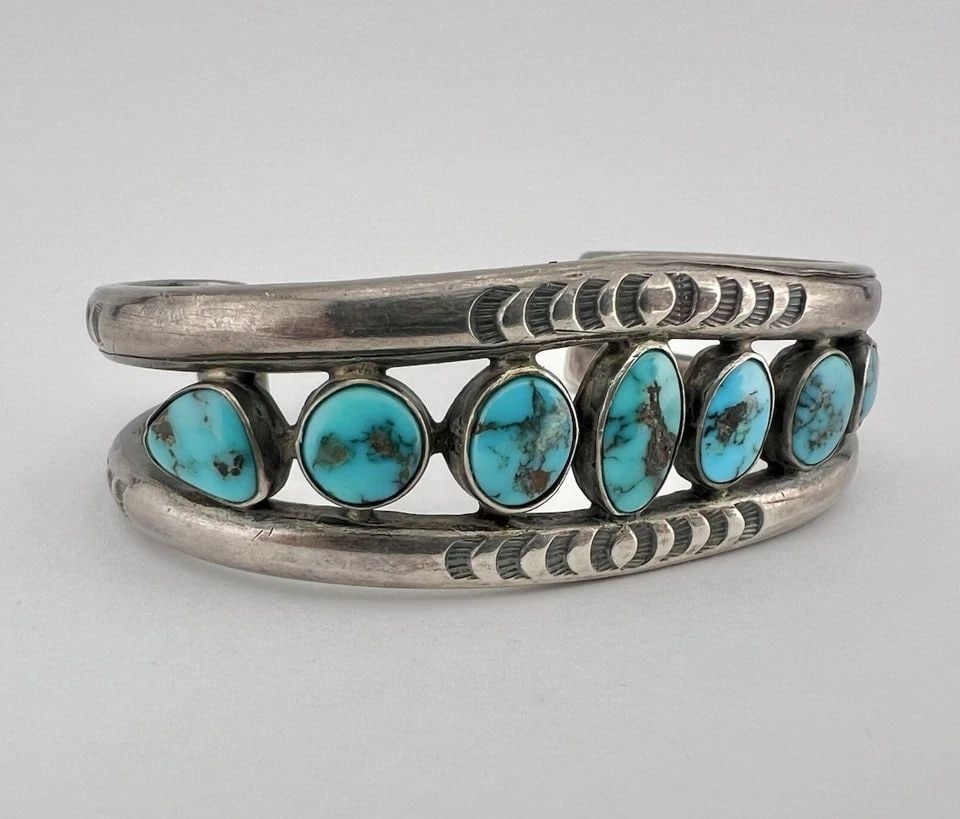 EARLY 1940'S NAVAJO COIN SILVER INGOT BISBEE TURQUOISE STAMPED CUFF BRACELET: Early 1940's Navajo Coin Silver Ingot Bisbee Turquoise Stamped Cuff Bracelet Cuff is 5 1/4" tip to Tip and has a 1 1/2" Wide Slightly Adjustable Gap Cuff Is About 1" Wide In the Center Weight is 58.3 