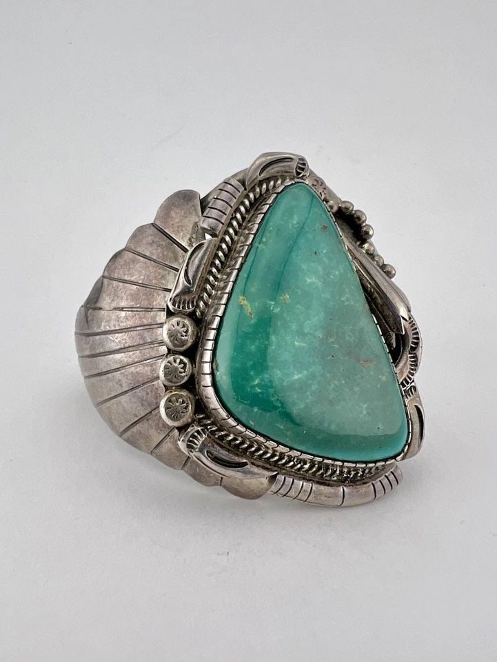 HUGE JEROME BEGAY NAVAJO STERLING SILVER BLUE GEM TURQUOISE CUFF BRACELET 86.7G: HUGE Vintage Jerome Begay Navajo Sterling Silver Blue Gem Turquoise Cuff Bracelet 86.7g Cuff is 5 1/8" tip to Tip and has a 1 1/4" Wide Adjustable Gap Cuff Is 2 1/4" Wide In the Center Weight is 86.7 