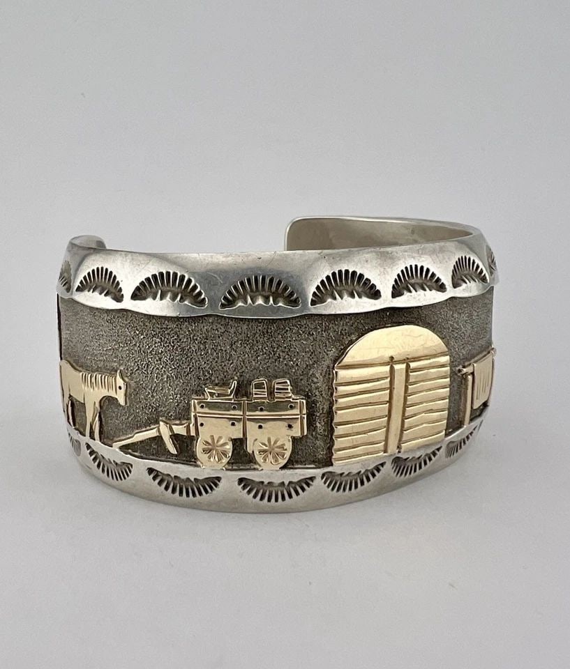 VTG NAVAJO STERLING SILVER & 14K GOLD PUEBLO VILLAGE PETROGLYPH CUFF BRACELET: VTG NAVAJO STERLING SILVER & 14K GOLD PUEBLO VILLAGE PETROGLYPH CUFF BRACELET Vtg Navajo Sterling Silver & 14k Gold Pueblo Village Petroglyph Cuff Bracelet Cuff is 5 1/4" tip to Tip and has a 1 1/2" A