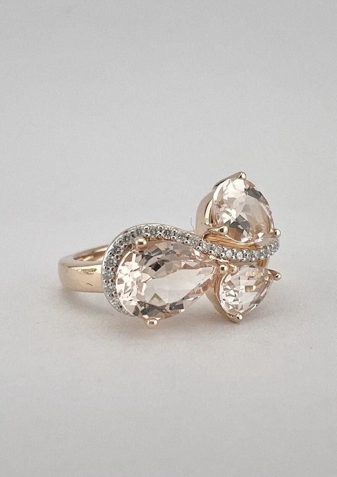 DESIGNER 14K ROSE GOLD PEAR SHAPED LIGHT PINK MORGANITE & DIAMOND BYPASS RING: DESIGNER 14K ROSE GOLD PEAR SHAPED LIGHT PINK MORGANITE & DIAMOND BYPASS RING Designer 14k Rose Gold Pear Shaped Light Pink Morganite & Diamond Bypass Ring Ring Size: 7.25 - Can Be Resized Metal: 14k 