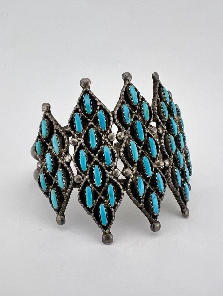 VTG QUAM ZUNI STERLING SILVER NEEDLEPOINT TURQUOISE 2 1/8" WIDE CUFF BRACELET: Vtg QUAM Zuni Sterling Silver Needlepoint Turquoise 2 1/8" Wide Cuff Bracelet Cuff is 5 1/4" tip to Tip and has a 1 1/4" Wide Slightly Adjustable Gap Cuff Is 2 1/8" Wide In The Center Weight is 48.6 G