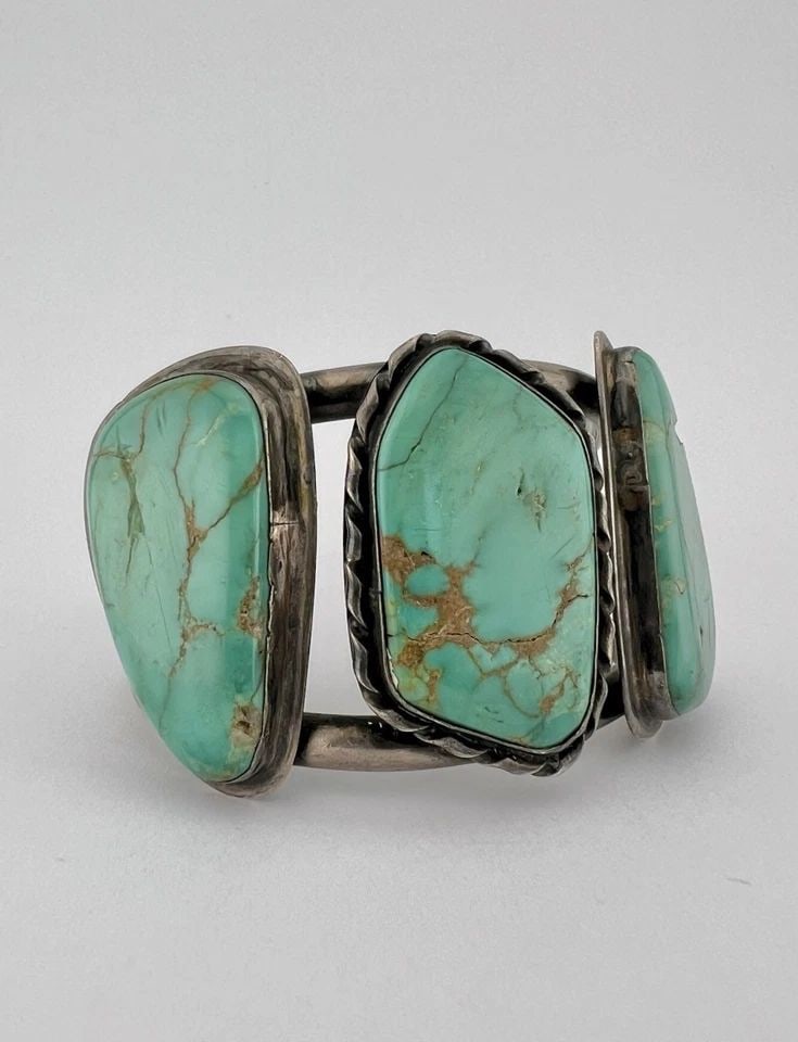 VTG NAVAJO STERLING SILVER HIGH GRADE ROYSTON TURQUOISE 3 STONE CUFF BRACELET: Vtg Navajo Sterling Silver High Grade Royston Turquoise 3 Stone Cuff Bracelet Cuff is Around 5 3/8" tip to Tip and has a 1 1/4" Wide Adjustable Gap Face of The Cuff Is 1 3/4" At Its Widest Point Weigh