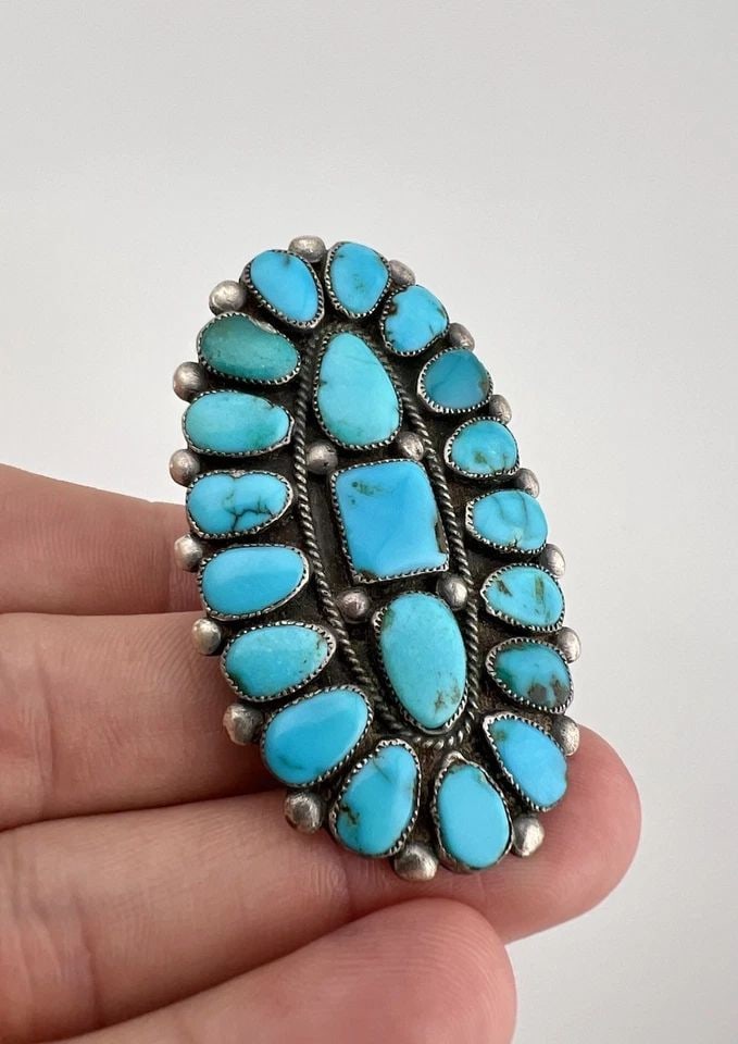 HUGE VINTAGE ONDELACY WEEBOTHEE ZUNI LONE MOUNTAIN TURQUOISE CLUSTER RING 2.25": HUGE Vintage Ondelacy Weebothee Zuni Lone Mountain Turquoise Cluster Ring 2.25" Ring Size: 9.5 - Can Be re Sized Weight is 17.5 Grams on my scale Metal: Sterling Silver Ring is 2 1/4" Tall In the Cent