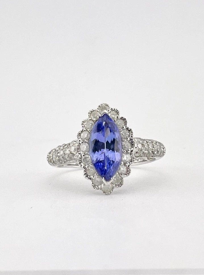 DESIGNER 14K WHITE GOLD MARQUISE TANZANITE & DIAMOND PAVE HALO RING: Designer 14k White Gold Marquise Tanzanite & Diamond Pave Halo Ring Ring Size: 7.55 - Can Be Resized Weight is 3.5 Grams on my scale Metal: 14k White Gold - Hallmarked Amazing Tanzanite & Round Cut Di