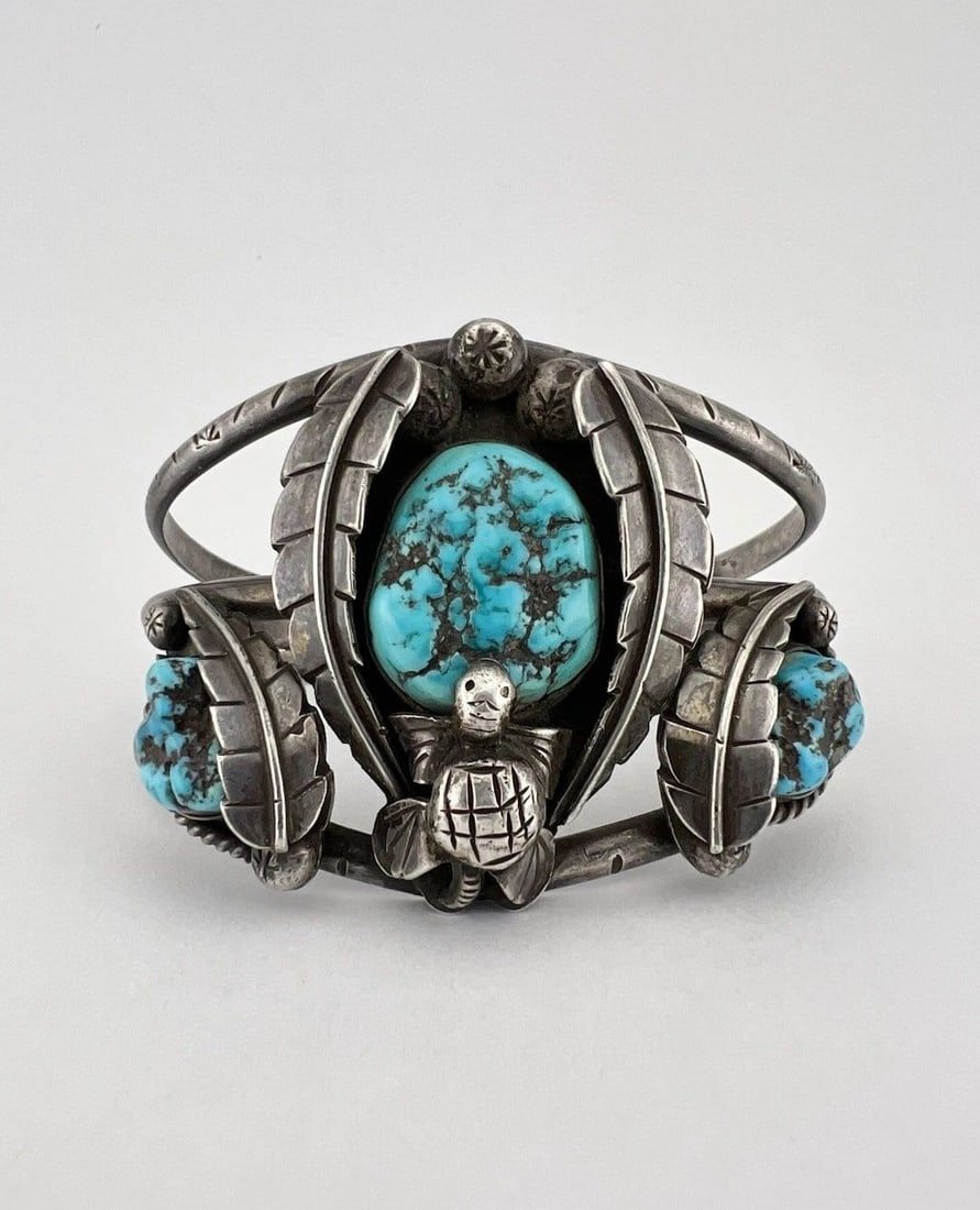 HUGE VTG NAVAJO STERLING SILVER SLEEPING BEAUTY TURQUOISE TURTLE CUFF BRACELET: HUGE Vtg Navajo Sterling Silver Sleeping Beauty Turquoise Turtle Cuff Bracelet Cuff is 6" tip to Tip and has a 1 1/4" Wide - Adjustable Gap Cuff Is 2" Wide In the Center Weight is 71.8 Grams on my sca