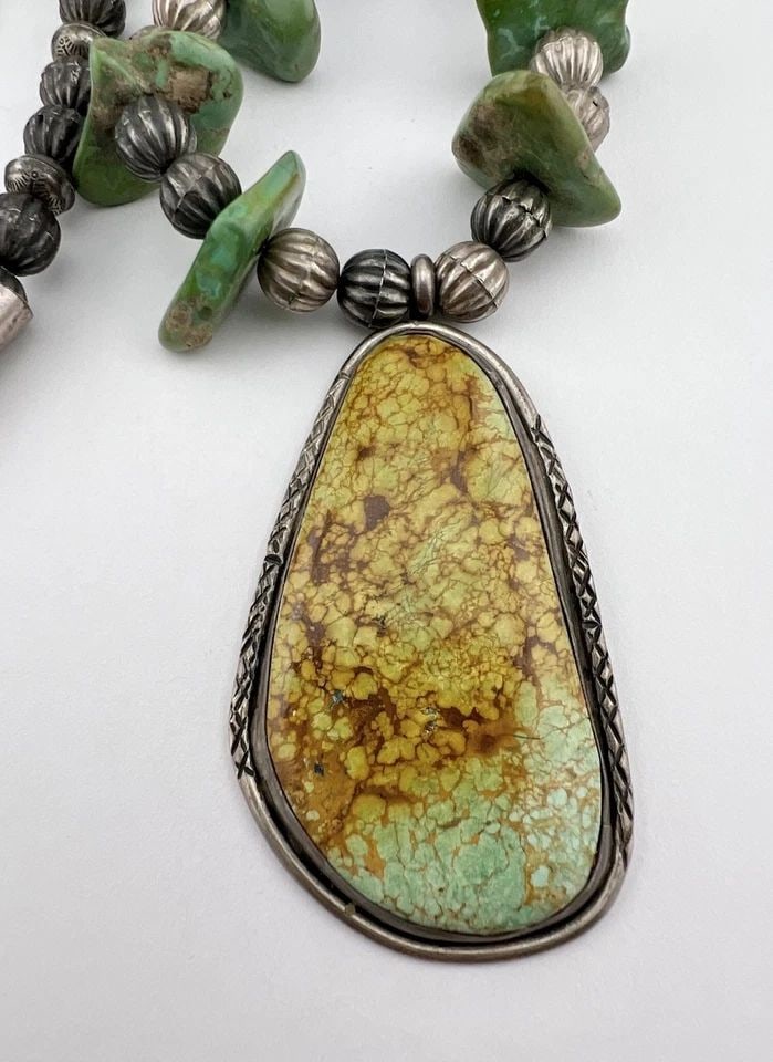 VTG NAVAJO STERLING SILVER ROYSTON TURQUOISE HOGAN FLUTED BENCH BEAD NECKLACE: Vtg Navajo Sterling Silver Royston Turquoise HOGAN Fluted Bench Bead Necklace MEASUREMENTS: Necklace measures 25" Tip To Tip Pendant Size: is 3" Tall by 1 5/8"Wide Stamped HOGAN Fluted Bench Bead Pear