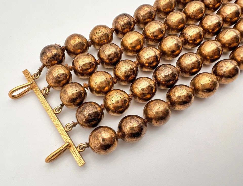 AUTHENTIC CHANEL FRANCE GOLD TONE FIVE ROW 2 5/8" WIDE BALL BRACELET: AUTHENTIC CHANEL FRANCE GOLD TONE FIVE ROW 2 5/8" WIDE BALL BRACELET Authentic CHANEL France Gold Tone Five Row 2 5/8" Wide Ball Bracelet Elevate your style with this vintage CHANEL Gold Tone Five Row
