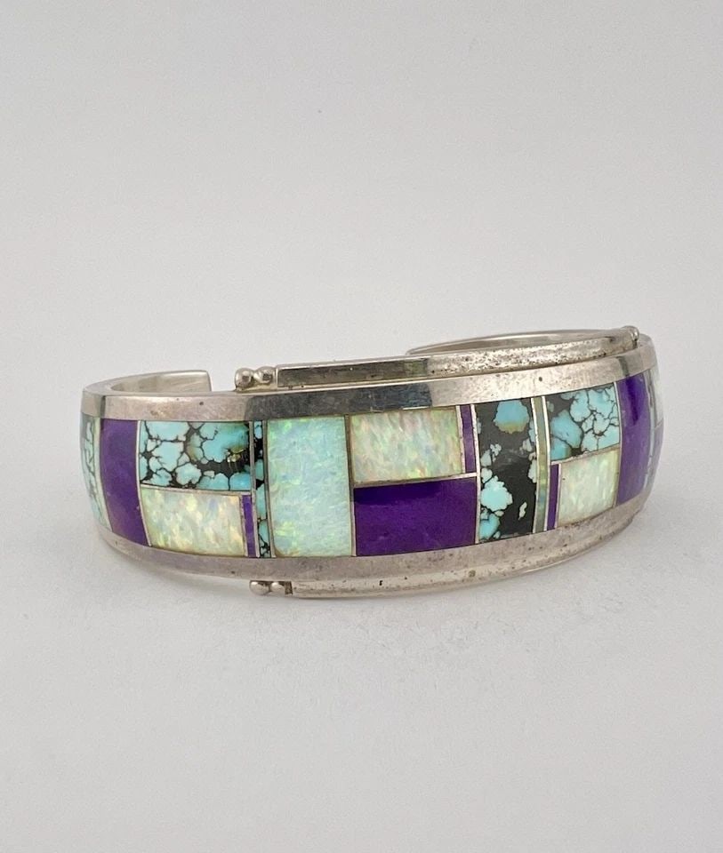 DONNY & DOROTHY CLARK STERLING SILVER MULTI GEMSTONE FLUSH INLAY CUFF BRACELET: DONNY & DOROTHY CLARK STERLING SILVER MULTI GEMSTONE FLUSH INLAY CUFF BRACELET Vtg Donny & Dorothy Clark Sterling Silver Multi Gemstone Flush Inlay Cuff Bracelet Cuff is Just Under 5 1/2" tip to Tip a