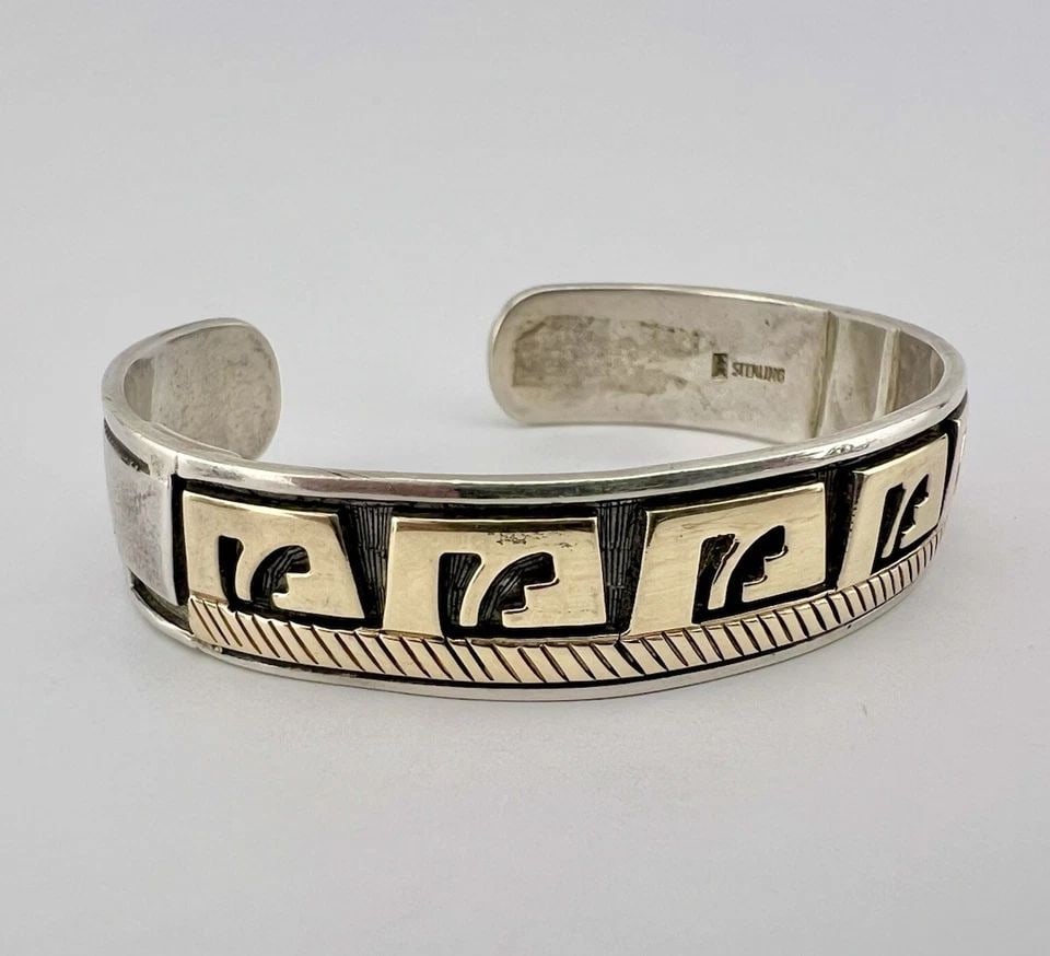 VTG MIKE BEGAY NAVAJO STERLING SILVER & 14K GOLD STAMPED OVERLAY CUFF BRACELET: VTG MIKE BEGAY NAVAJO STERLING SILVER & 14K GOLD STAMPED OVERLAY CUFF BRACELET Vtg Mike Begay Navajo Sterling Silver & 14k Gold Stamped Overlay Cuff Bracelet Cuff is Around 5 5/8" Tip to Tip and has a