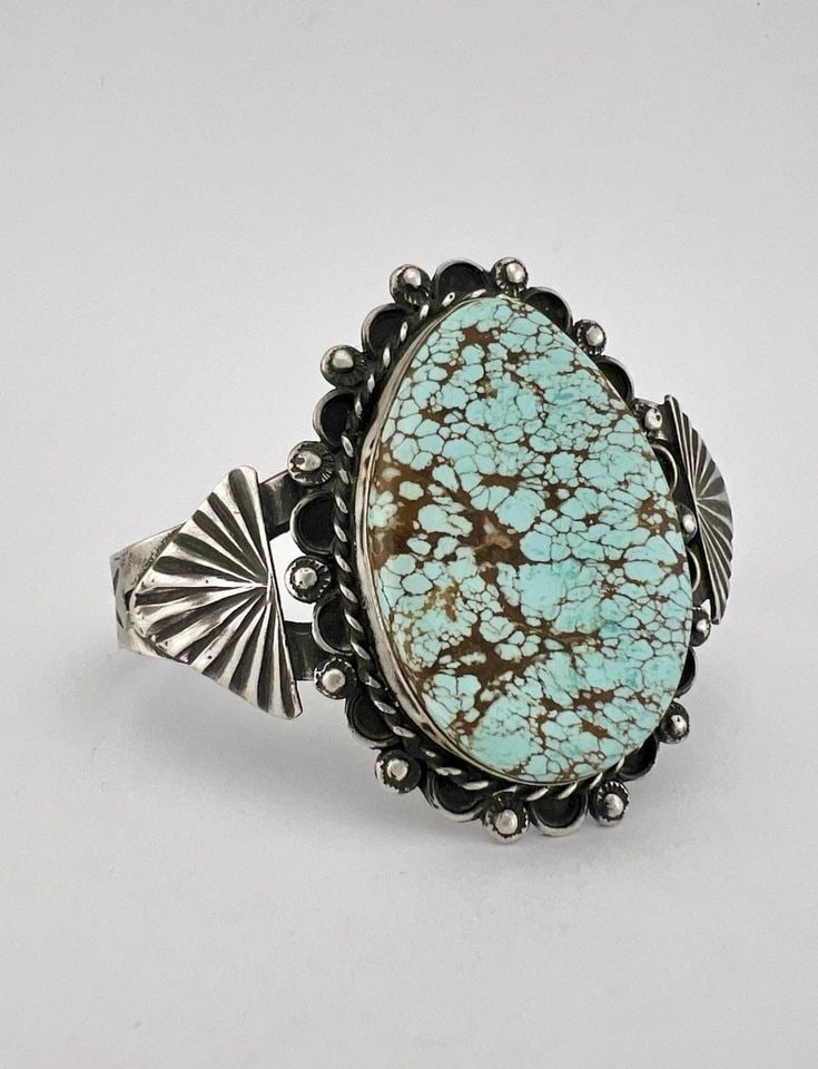 VTG NAVAJO STERLING SILVER NATURAL SPIDERWEB #8 TURQUOISE STAMPED CUFF BRACELET: Vtg Navajo Sterling Silver Natural Spiderweb #8 Turquoise Stamped Cuff Bracelet Cuff is 5 3/8" tip to Tip and has a 1 1/8" Wide Adjustable Gap Cuff Is Just Under 2" Wide In the Center Weight is 40.3 G