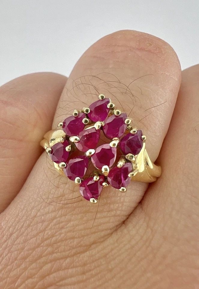 DESIGNER 10K YELLOW GOLD NATURAL PEAR SHAPED RUBY CLUSTER RING: Designer 10k Yellow Gold Natural Pear Shaped Ruby Cluster Ring Ring Size: 10 - Can Be Resized Metal: 10k Yellow Gold - Tested & Hallmarked Weight is 3.9 Grams on my scale Ring is 15.5mm Wide In The Ce