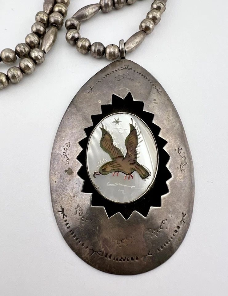OLD ZUNI STERLING SILVER FLUSH GEM'S EAGLE SHADOWBOX BENCH BEAD NECKLACE PENDANT: OLD Zuni Sterling Silver Flush Gem's Eagle Shadowbox Bench Bead Necklace Pendant MEASUREMENTS: Necklace measures 24.5" Tip To Tip Pendant is 3 1/4" Tall by About 2" Wide Bench Bead Pearls Are 6mm Wide