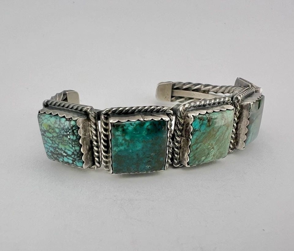 VTG NAVAJO STERLING SILVER NATURAL SPIDERWEB TURQUOISE TWIST CUFF BRACELET 59.5G: Vtg Navajo Sterling Silver Natural Spiderweb Turquoise Twist Cuff Bracelet 59.5g Cuff is 5 5/8" tip to Tip and has an Around 1 3/8" Wide Slightly Adjustable Gap Cuff Is 3/4" Wide In the Center Weight 