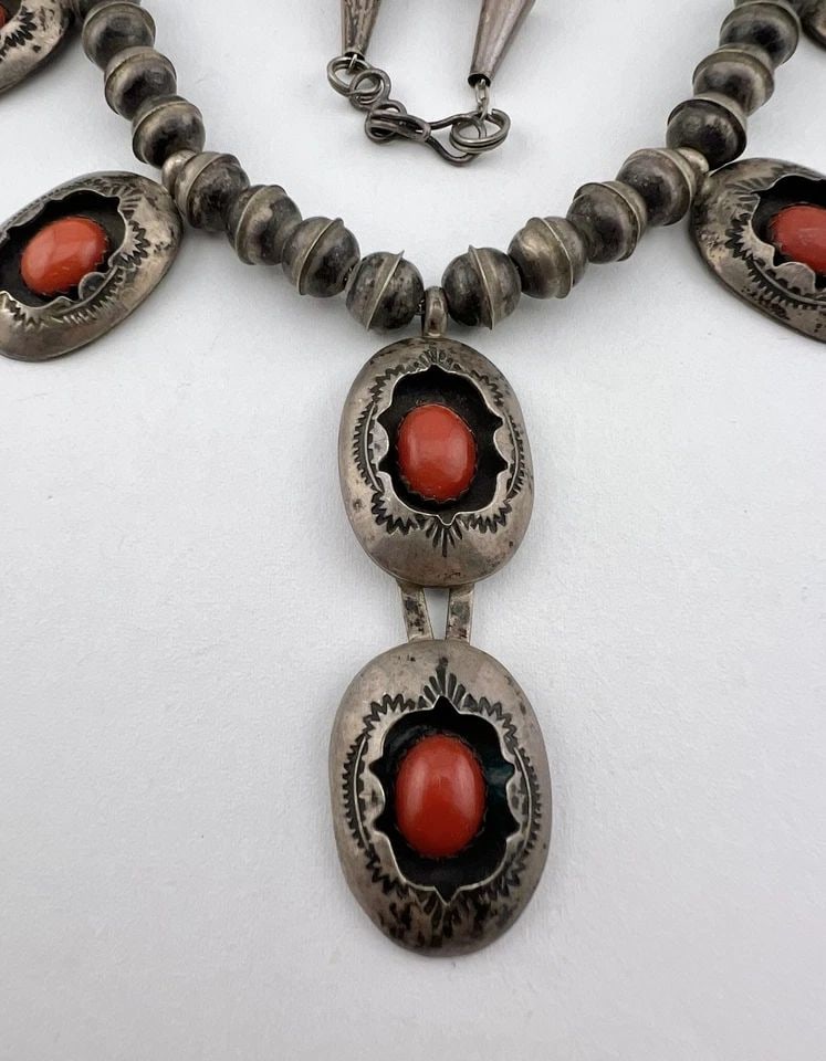 VTG NAVAJO STERLING SILVER NATURAL RED CORAL STAMPED SHADOWBOX DANGLE NECKLACE: VTG NAVAJO STERLING SILVER NATURAL RED CORAL STAMPED SHADOWBOX DANGLE NECKLACE Vtg Navajo Sterling Silver Natural Red Coral Stamped Shadowbox Dangle Necklace MEASUREMENTS: Necklace measures 17.75" tip