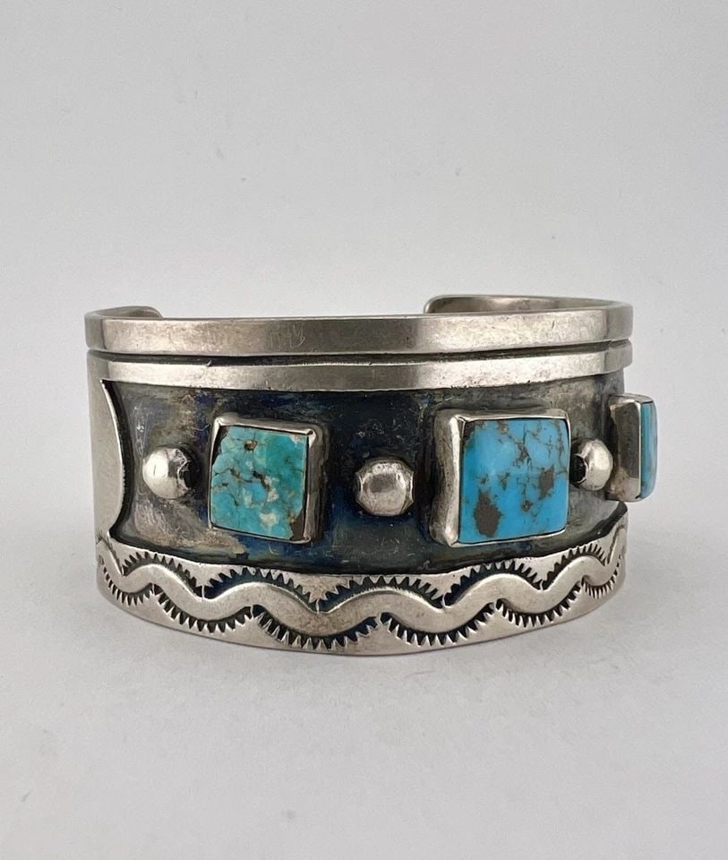 VINTAGE NAVAJO STERLING SILVER BLUE GERM TURQUOISE STAMPED CUFF BRACELET 63.3G: VINTAGE NAVAJO STERLING SILVER BLUE GERM TURQUOISE STAMPED CUFF BRACELET 63.3G Vintage Navajo Sterling Silver Blue Germ Turquoise Stamped Cuff Bracelet 63.3g Cuff is 5 3/8" tip to Tip and has a 1 1/2"