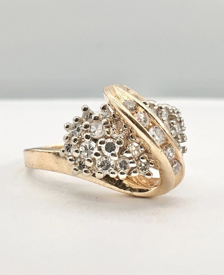 DESIGNER 14K YELLOW GOLD .75CT PRONG SET DIAMOND INFINITY CLUSTER BAND RING: DESIGNER 14K YELLOW GOLD .75CT PRONG SET DIAMOND INFINITY CLUSTER BAND RING Designer 14k Yellow Gold .75ct Prong Set Diamond Infinity Cluster Band Ring Ring Size: 6.25 - Ring is 7mm Wide Metal: 14k Ye