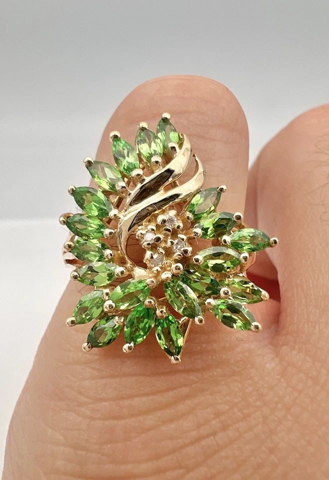 DESIGNER 10K YELLOW GOLD NATURAL GREEN TSAVORITE & DIAMOND CLUSTER RING: DESIGNER 10K YELLOW GOLD NATURAL GREEN TSAVORITE & DIAMOND CLUSTER RING Designer 10k Yellow Gold Natural Green Tsavorite & Diamond Cluster Ring Ring Size: 8.25 - Can Be Resized Metal: 10k Yellow Gold 