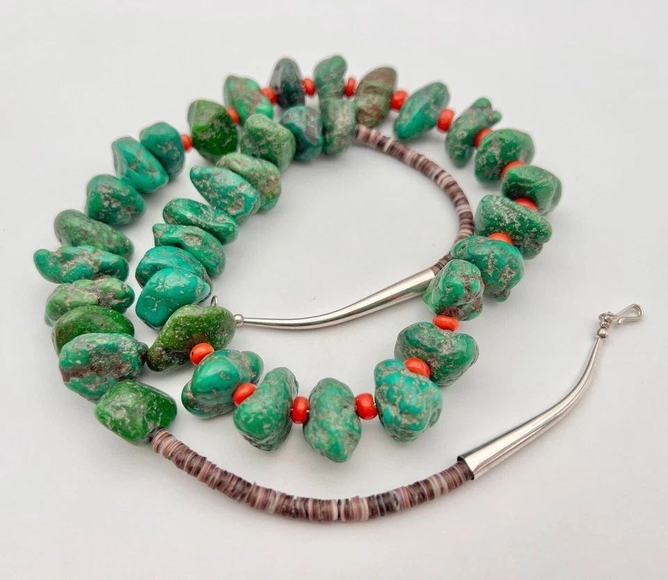 VTG NAVAJO SONORAN GOLD TURQUOISE & CORAL HEISHI CHUNK BEAD NECKLACE 29" -177.5G: VTG NAVAJO SONORAN GOLD TURQUOISE & CORAL HEISHI CHUNK BEAD NECKLACE 29" -177.5G Vtg Navajo SONORAN GOLD Turquoise & Coral Heishi Chunk Bead Necklace 29" -177.5g Necklace is 29" Long The Turquoise Sto
