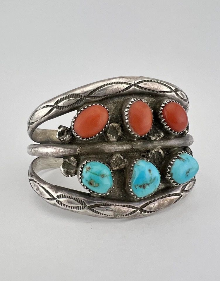 VTG IHMSS NAVAJO STERLING SILVER NATURAL TURQUOISE & CORAL STAMPED CUFF BRACELET: VTG IHMSS NAVAJO STERLING SILVER NATURAL TURQUOISE & CORAL STAMPED CUFF BRACELET Vtg IHMSS Navajo Sterling Silver Natural Turquoise & Coral Stamped Cuff Bracelet Cuff is 5 1/2" tip to Tip and has a 7/