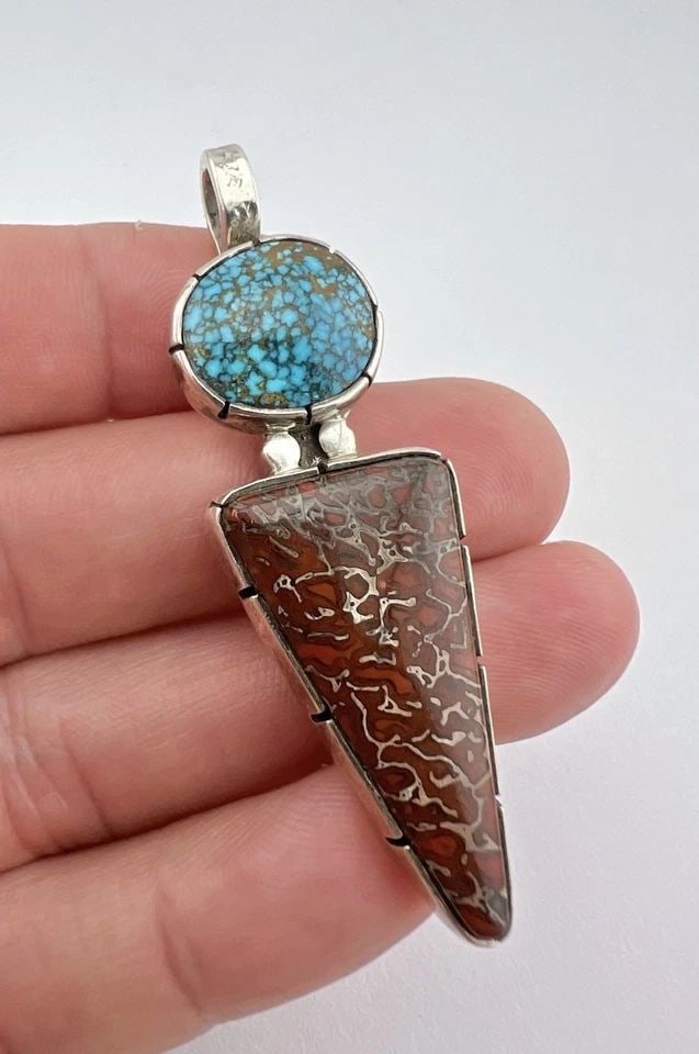 VTG NAVAJO STERLING SILVER LONE MOUNTAIN TURQUOISE & FOSSILIZED DINOSAUR PENDANT: Vtg Navajo Sterling Silver Lone Mountain Turquoise & Fossilized Dinosaur Pendant Size: 2 1/2" Tall With Bail & 3/4" Wide Weight is 19.2 Grams on my scale Metal: Sterling Silver Amazing High Grade Webb