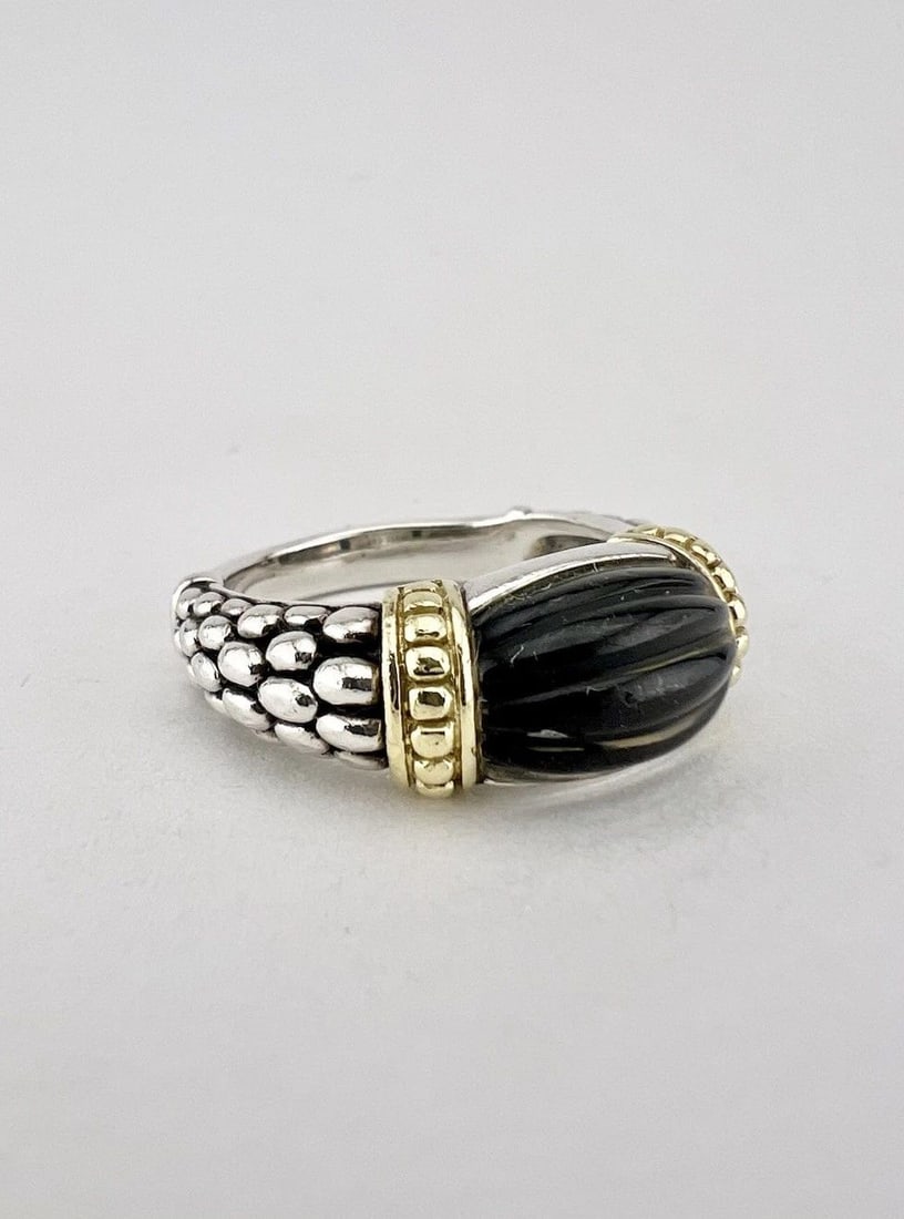 DESIGNER LAGOS STERLING SILVER & 18K CAVIAR CARVED BLACK QUARTZ ONYX RING: Designer LAGOS Sterling Silver & 18k Caviar Carved Black Quartz Onyx Ring Ring Size: 9 - Can Be Resized Weight is 9.0 Grams on my scale Metal: Sterling Silver & 18k Yellow Gold Ring is 3/8" (9mm) Tall