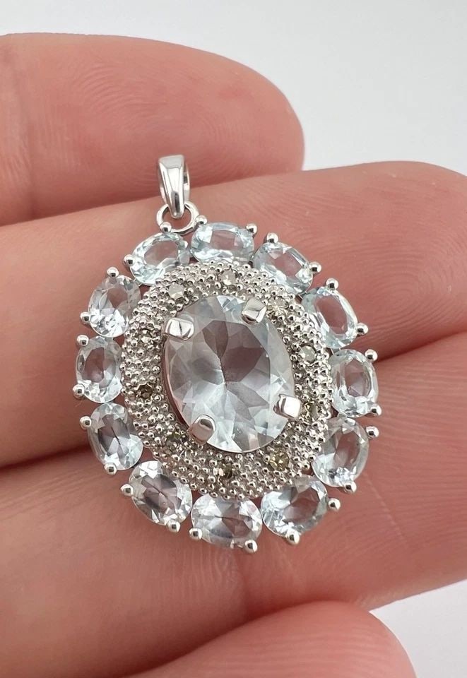 DESIGNER 10K WHITE GOLD LIGHT BLUE AQUAMARINE & DIAMOND HALO CLUSTER PENDANT: DESIGNER 10K WHITE GOLD LIGHT BLUE AQUAMARINE & DIAMOND HALO CLUSTER PENDANT Designer 10K White Gold Light Blue Aquamarine & Diamond Halo Cluster Pendant Size: 1 1/8" Tall With Bail By 3/4" Wide & 1/2