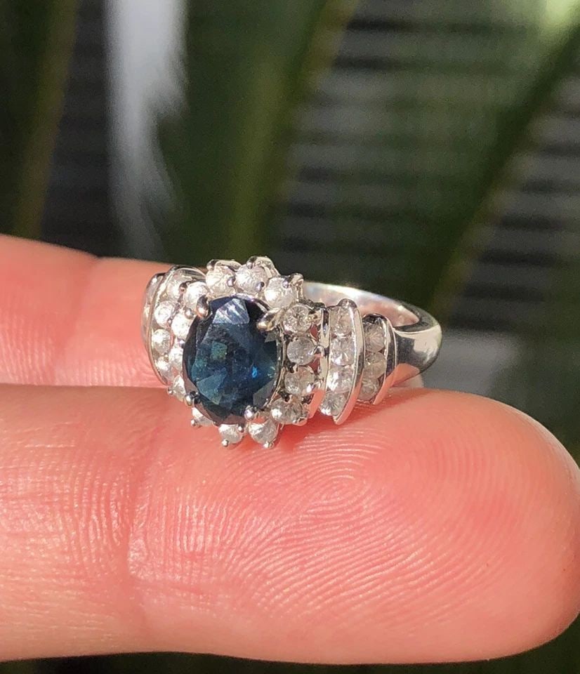 VINTAGE ESTATE 14K WHITE GOLD NATURAL BLUE SAPPHIRE & CZ ACCENT CLUSTER RING: VINTAGE ESTATE 14K WHITE GOLD NATURAL BLUE SAPPHIRE & CZ ACCENT CLUSTER RING Vintage Estate 14k White Gold Natural Blue Sapphire & Cz Accent Cluster Ring Size: 4.75 Weight is 4.1 Grams on my scale Met